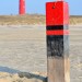 Pole And Lighthouse - Texel, The Netherlands